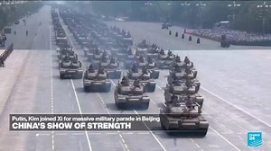 Dual message: Exerting military might, Xi says China's role is 'making, securing, protecting peace'