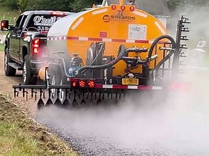 Stratos Asphalt Distributor spraying CRS-2P and chip sealing a cemetery