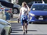 Hilary Duff leaves the gym with blue jacket tied around waist