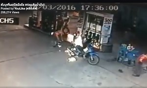 Close call: Motorists warned not to use mobile phones at petrol stations after motorbike catches fire (VIDEO)