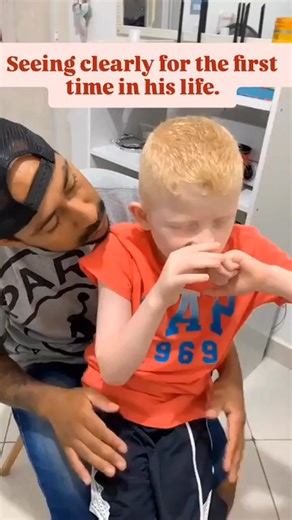 Lisa Geng on Instagram: "This beautiful little boy has oculocutaneous albinism, a genetic condition that affects pigmentation of the skin, hair, and eyes, and often causes significant vision challenges. Low vision and light sensitivity can make the world feel confusing and overwhelming. You can see how nervous and withdrawn he is at first. His father is so gentle, patient, and loving, helping him put the glasses on slowly, at his child’s pace, never rushing him. And the moment he can finally see