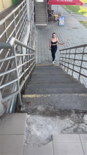 Urban Fitness Journey: Woman Climbing Outdoor Stairs