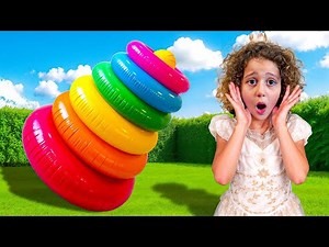 Sierra and Rhia play with giant colourful stacking rings - Learn colours with giant stacking rings