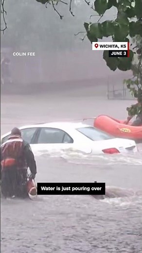 Cars and roads submerged in water during record rainfall in Kansas