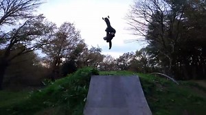 Guy Does Mountainboarding on Dirt and Wooden Ramps
