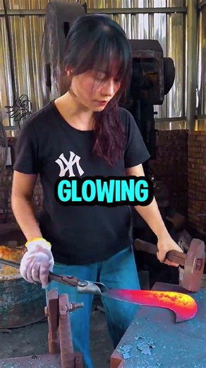 Female Blacksmith Forging a Sickle