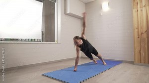 Planking and rotating arms exercise. High intensity interval training at home