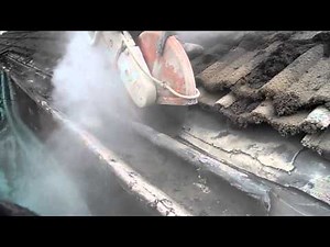 Cutting off the concrete gutters by Concrete Gutter Removals Ltd