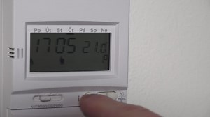 Setting higher heating thermostat temperature on digital display, closeup view | Premium Stock Video Footage