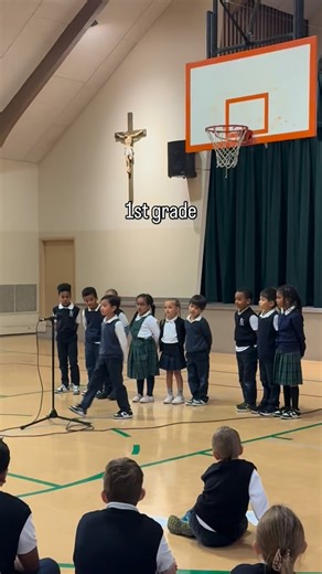 First graders ❤️ Every month, students study a poem to perform at the end of the month Virtue’s Assembly. An assembly where students also gather in diverse grade level communities to share how they applied the current month’s Catholic Virtue, and the Saint that put that virtue into practice during their life. It allows the students to think critically, and put the virtue into action for the whole month. They write about how they put the virtue into action, gather within their communities and sha