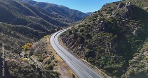 Drone Flying over Curvy Road in Between Mountains. Arizona State Route 87