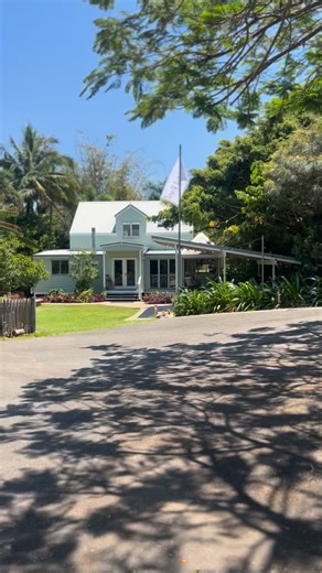 Terry Delalande - Real Estate Yeppoon on Instagram: "🌿 COMING SOON: “The Last Resort” your private coastal sanctuary 🌿 33 Meilland St, Yeppoon. You arrive through an electric gate, the drive winding past towering ferns and fruiting trees. The cottage beckons with wide verandahs and shaded nooks. Step inside: downstairs, two cosy bedrooms open to verandah views of your private rainforest. A kitchen built for gathering, a living/dining area warmed by a pot-belly wood heater, practical, yet poeti
