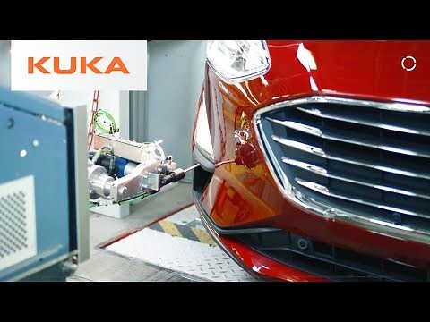 People and Robots Adjust Ford Headlights by Working Together