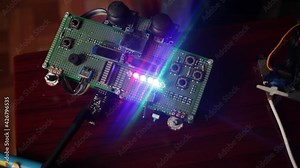 DIY, the machine. Home experiments, robotics, smart engineer. Toy for the child. glowing remote control. Motherboard, tools for creating electronic devices. Technical discussion, future technologies