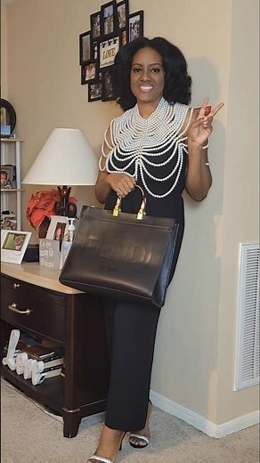 Black jumpsuit outfit idea.Styling a chest piece to dress up a simple look.Easy outfit inspiration.