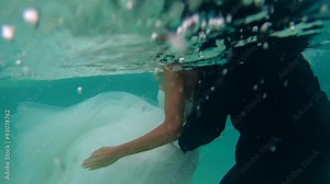 UNDERWATER: The bride and groom are preparing for an underwater photo shoot, Indian Ocean, Maldives