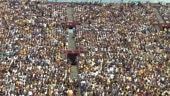 HD Shot of a stadium crowd doing the wave in sync.