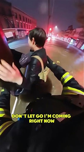 Hero Firefighter Rescues Woman Trapped in Raging Floodwaters!