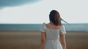 Beautiful athletic girl walking along the ancient ruined buildings. Slow motion. Shooting on the Steadicam