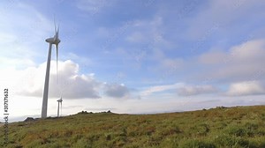 eolic turbine wind renewable energy farm on top of mountain 4k
