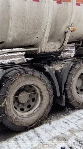 A heavy-duty truck fitted with anti-skid chains