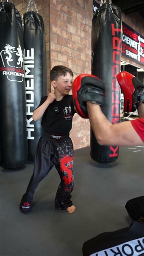Child in martial arts combination - kickboxing for children under 10 years old