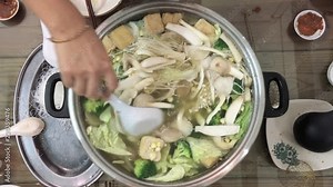 Chinese vegetarian hot pot mixed all vegetables and tofu together for a healthy meal.
