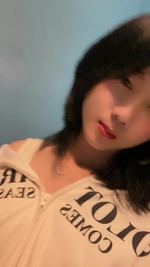 Young Adult in White Hoodie with 'LOT COMES' Design