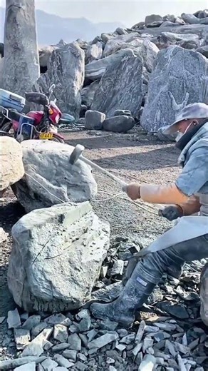 Splitting Large Rocks Manually Using Hammers And Chisels To Create Building Materials In Stone Mines