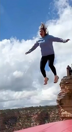 Cliff airbag is wild! 😱🔥 Guy jumps, girl flies! #ScaryRide #TravelWonder