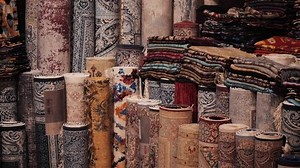 Details of traditional Turkish carpet in Istanbul shop, Turkey. Close up of Middle Eastern Arabian carpets in market store.