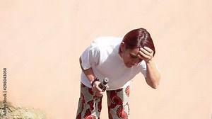 drunk girl standing up vomiting in front of the camera