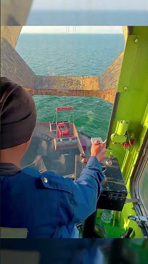 Crane operator POV Loading Coal on Cargo Vessel