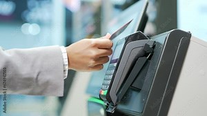 Close up Woman At Counter Buy electronic payment supermarket by credit card close-up. African american female hand pay for purchases in stores Contactless NFC Terminal Closeup card reader