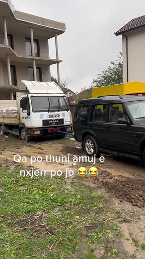 Construction Site Unloading: Cement and Vehicles In Action
