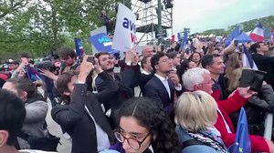 Cheers for Macron, Le Pen supporters boo results