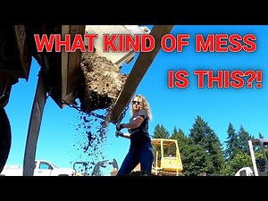 CLAY & ROCK HUNG UP IN THE TAILGATE WHILE SPREADING. DUMP TRUCK OWNER OPERATOR.