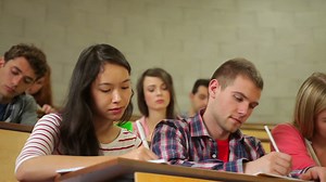 Students listening carefully in lecture hall and taking notes Premium Stock Video Footage