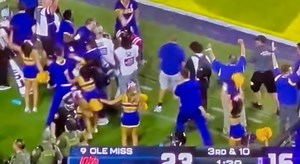 VIDEO: LSU Cheerleader Is Getting Ripped On Social Media For Shoving An Ole Miss Player During Tigers Touchdown