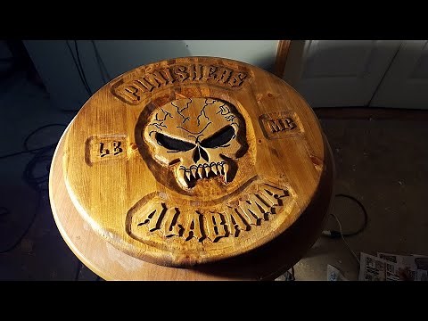 Carving a wooden plaque from 2x4s with a dremel tool.