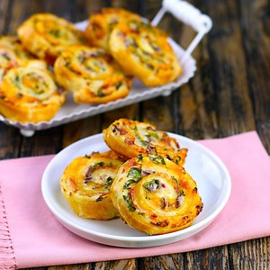 2.5M views · 86K shares | When your party guests get a taste of these scrumptious little swirls, you won't be able to bake them fast enough!  FULL RECIPE: www.scrumdiddlyumptious.com/cheese-bacon-spirals | Scrumdiddlyumptious | Facebook