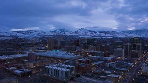 Salt Lake City Downtown in Winter in Twilight. Blue Hour. Utah, USA. Aerial Hyper Lapse, Time Lapse. Drone Flies Sideways
