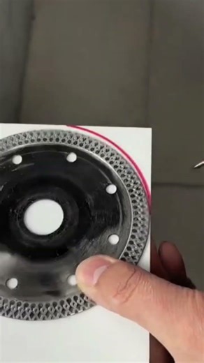 The process of marking a ceramic using a grinding wheel