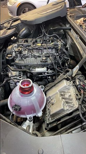 Audi Q5 contaminated coolant bottle.