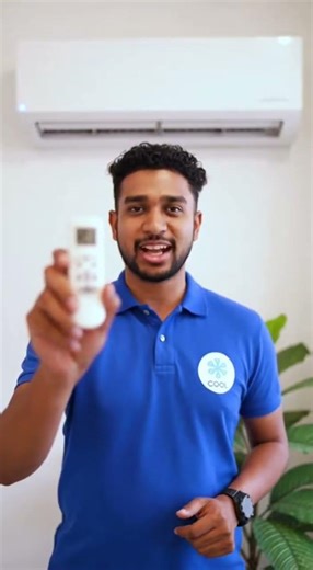 Technician setting timer on AC remote, explaining confidently