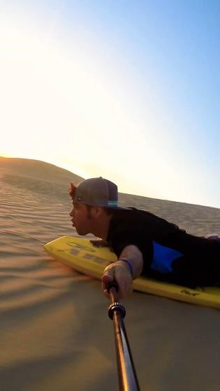 Sandboarding down a never-ending hill