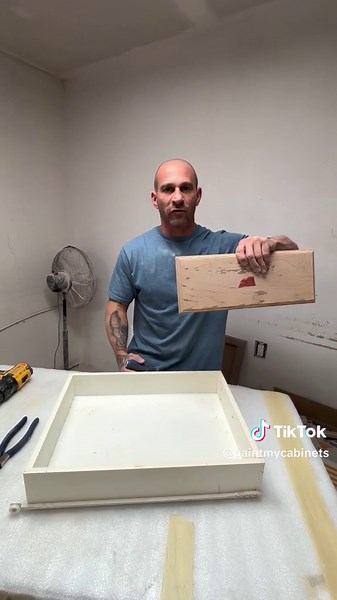 How to remove a drawer face that has been stapled to the box without damaging it. #howto #kitchen #painting #kitchenpainting #cabinetpainting #disassembly #paintmycabinets