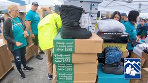 As part of the tenth year of the Community Clothesline Project, Anchorage Cops for Community, Anchorage Police Department, and community members were at Clark Middle School to distribute clothes to students and families in preparation for the upcoming school year. #ASDShineBright #givingback #Alaska | Anchorage School District