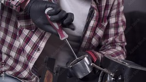 Trying to fix coffee machine. Service and repair of coffee maker. Adult handyman repairing coffee machine by screwdriver at home. Male mend percolator in goggles and black rubber gloves Stock Video