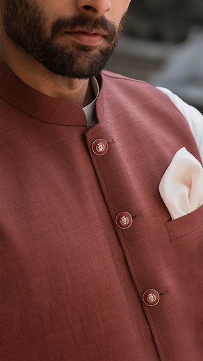 Distinguished by its exquisite craftsmanship, the rust-textured waistcoat boasts fine contrast piping and topstitching, making it a standout piece for any occasion. #EidVibes #DandyDesigns #NewCollection | Dandy Designs